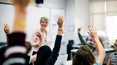 Teacher in classroom with students