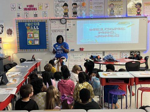 Image of President Jones reading with students at Northside Elementary